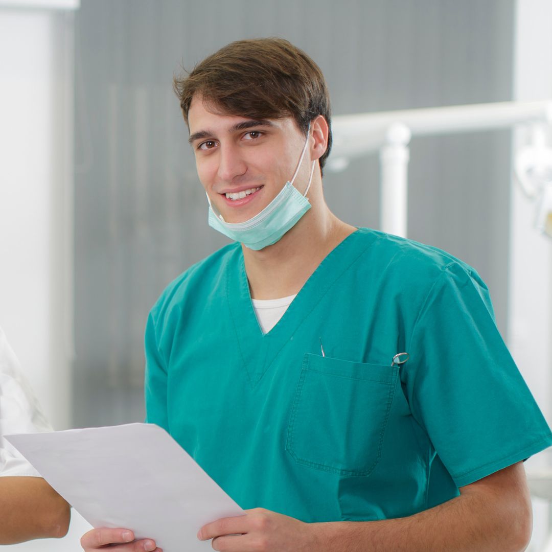 Dental assistant holding paper