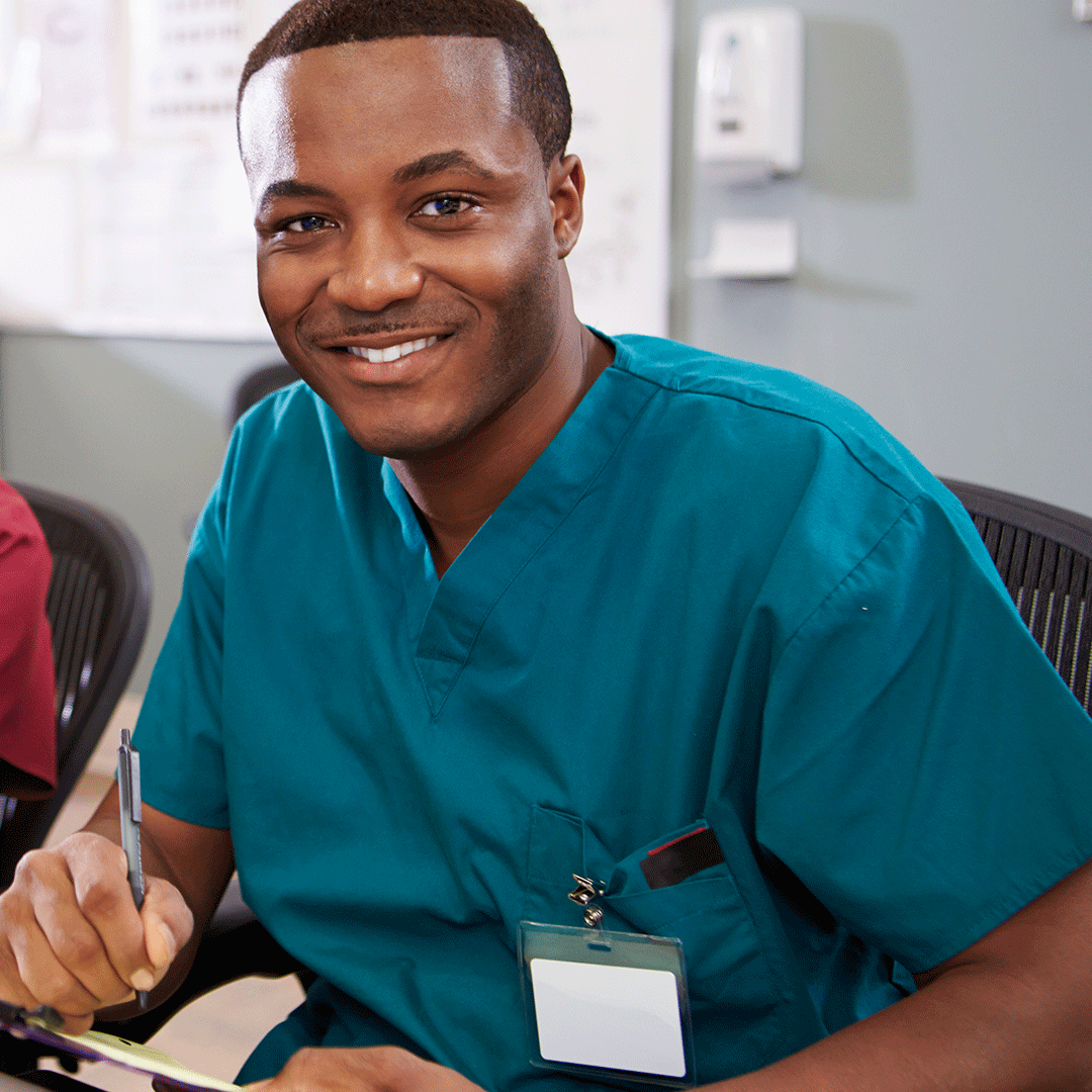 Medical Administrative Assistant at his desk