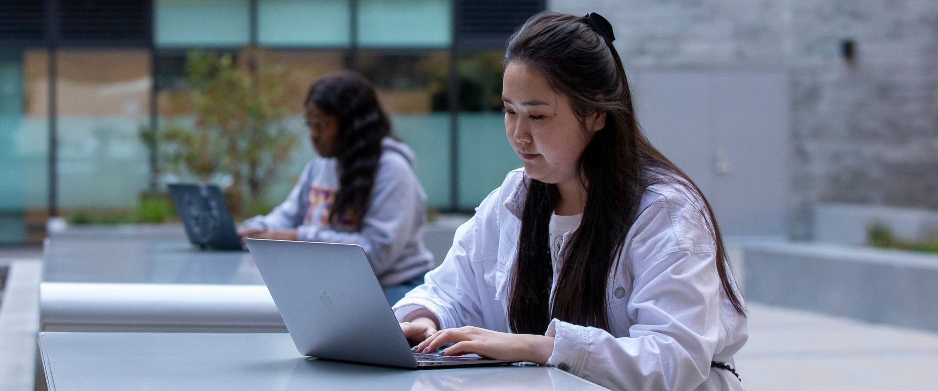 Student taking online course outdoors