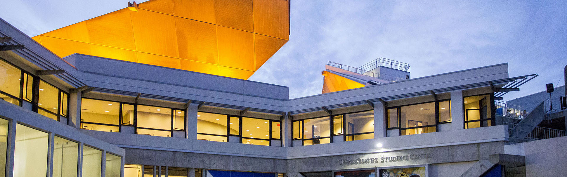 SF State César Chávez Student Center, lit up in the evening