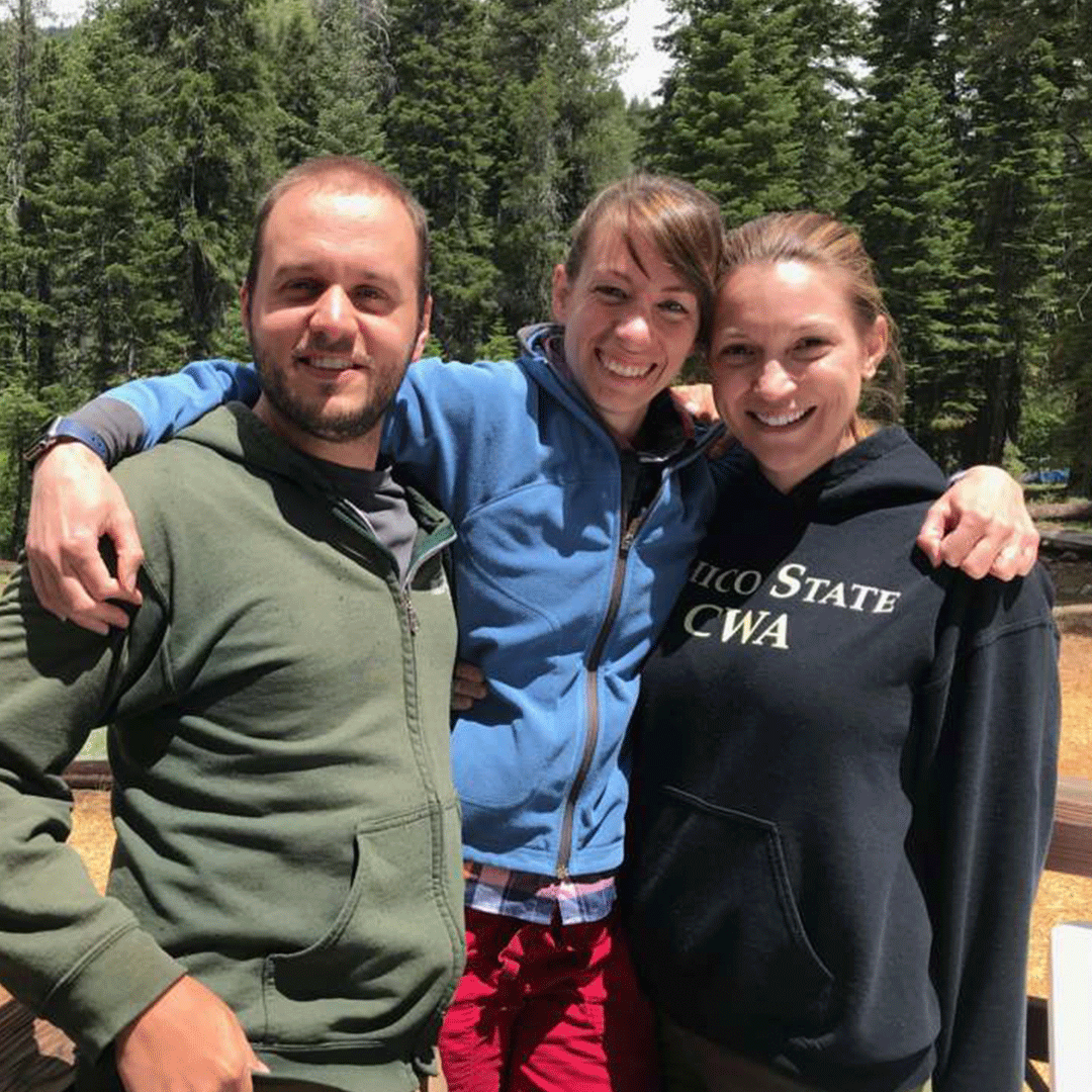 Trio of students with arms around each other at the Sierra Nevada Field Campus