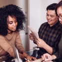 Three people working together