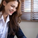 Paralegal working on a laptop at her desk