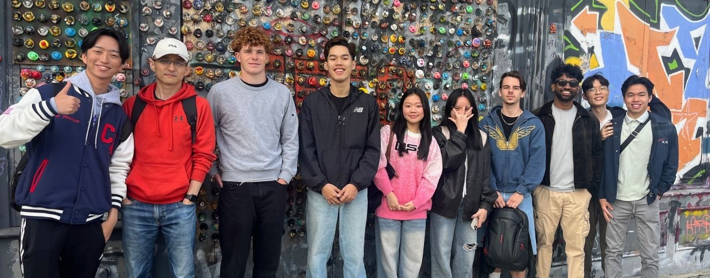 International students in front of street art