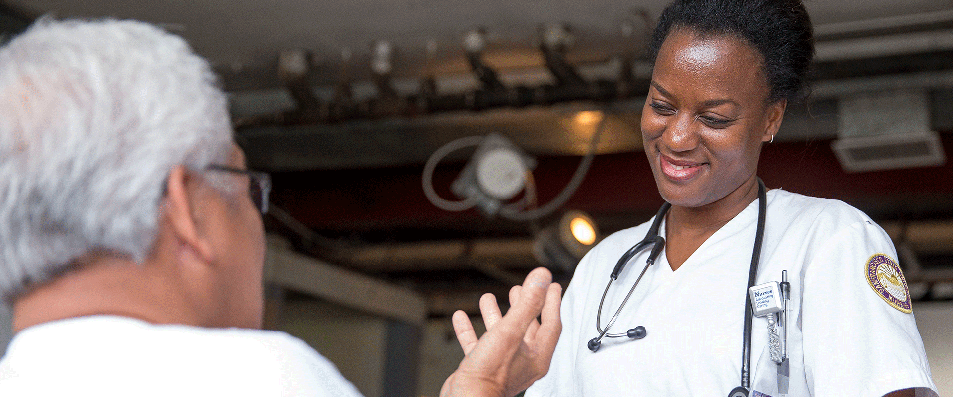 CMA smiles while speaking with patient