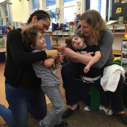 Pair of deafblind students with their deafblind interveners